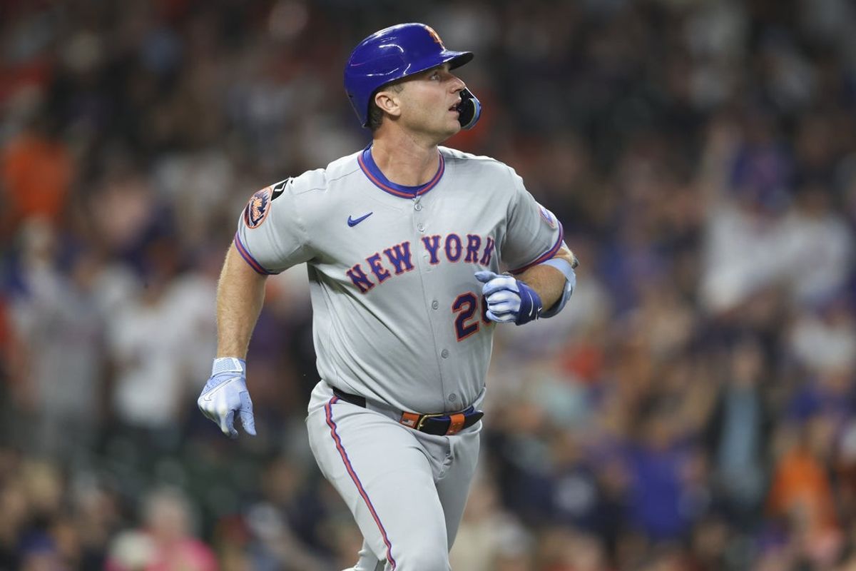 Mar 28, 2025; Houston, TX, USA; New York Mets first baseman Pete Alonso (20) watches a fly ball during the game against the Houston Astros at Daikin Park. Mandatory Credit: Troy Taormina-Imagn Images