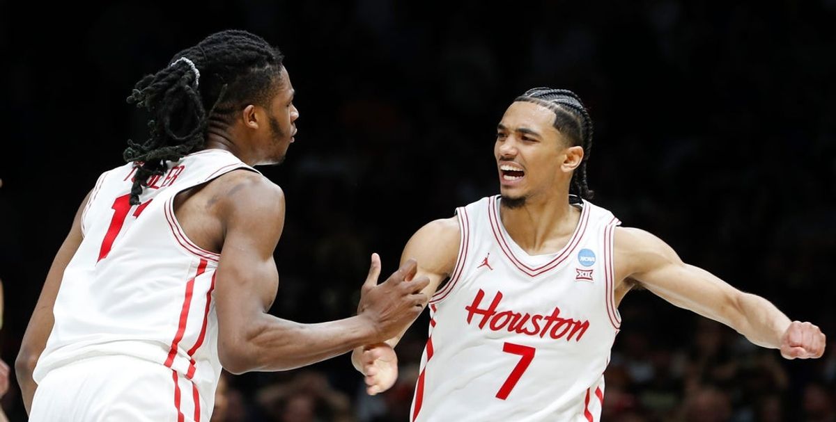 Houston Cougars forward Joseph Tugler (11) and Houston Cougars guard Milos Uzan (7) celebrate Saturday, March 29, 2025, during the NCAA Tournament Sweet 16 game against the Purdue Boilermakers at Lucas Oil Stadium in Indianapolis. Houston Cougars won 62-60.