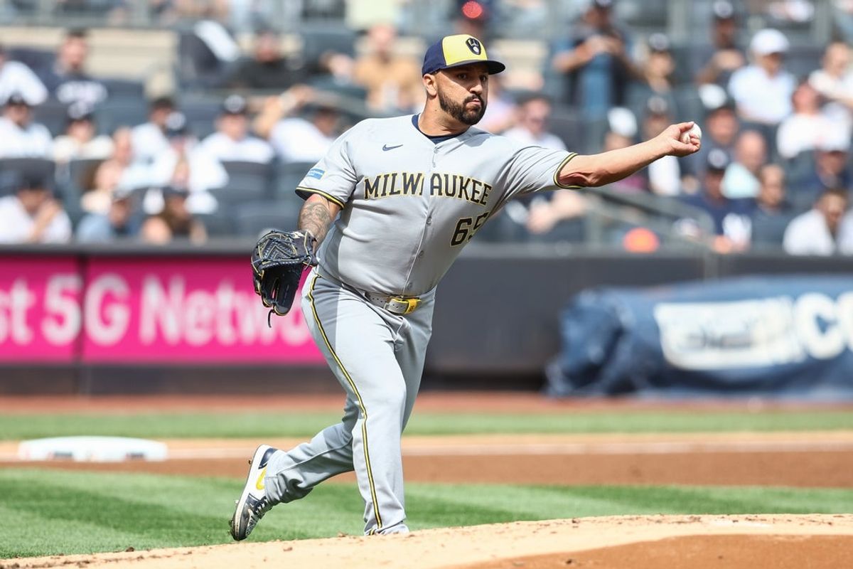 Mar 29, 2025; Bronx, New York, USA; Milwaukee Brewers starting pitcher Nestor Cortes (65) throws a runner out at first base in the first inning against the New York Yankees at Yankee Stadium. Mandatory Credit: Wendell Cruz-Imagn Images