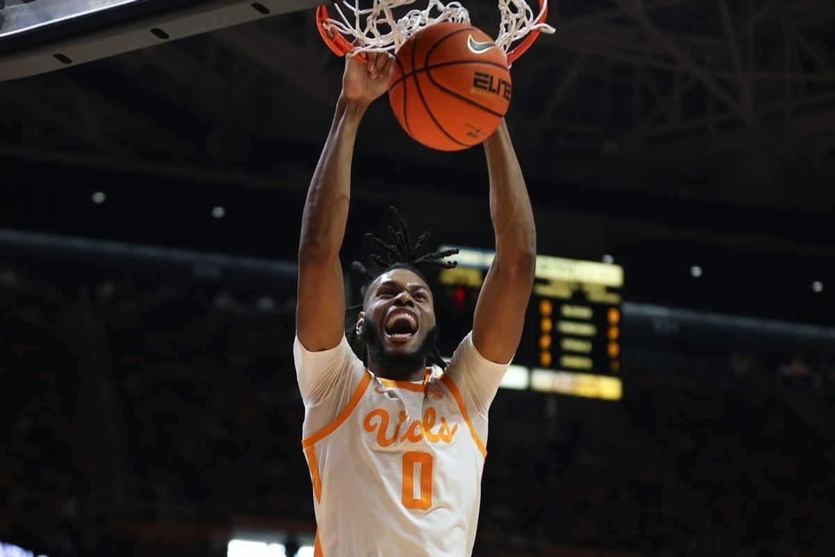 Dec 9, 2023; Knoxville, Tennessee, USA; Tennessee Volunteers forward Jonas Aidoo (0) dunks the ball against the Illinois Fighting Illini during the first half at Food City Center at Thompson-Boling Arena.