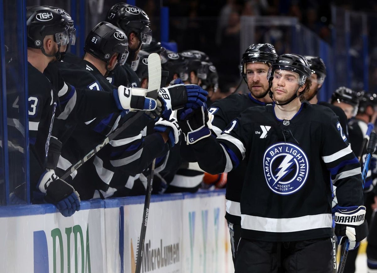 Mar 29, 2025; Tampa, Florida, USA; Tampa Bay Lightning center Brayden Point (21) is congratulated after he scored a goal against the New York Islanders during the first period at Amalie Arena. Mandatory Credit: Kim Klement Neitzel-Imagn Images