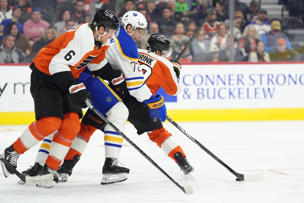 Mar 29, 2025; Philadelphia, Pennsylvania, USA; Buffalo Sabres center Tage Thompson (72) battles for the puck against Philadelphia Flyers defenseman Travis Sanheim (6) in the third period at Wells Fargo Center. Mandatory Credit: Kyle Ross-Imagn Images