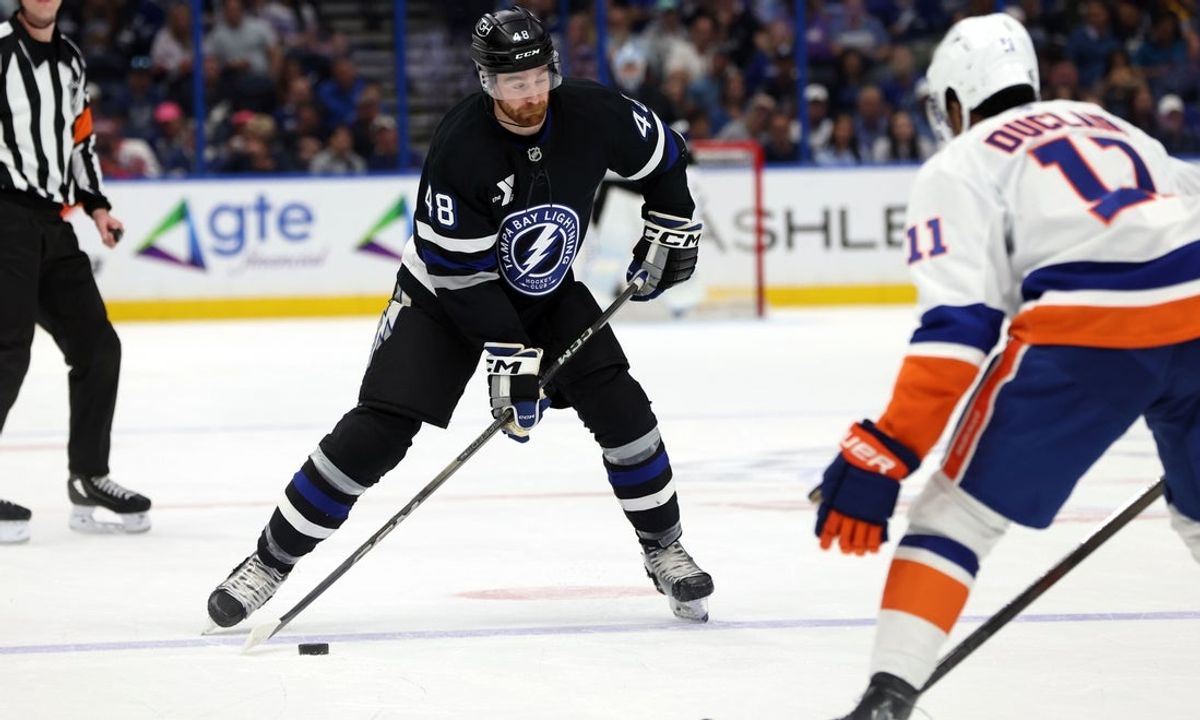 Mar 29, 2025; Tampa, Florida, USA; Tampa Bay Lightning defenseman Nick Perbix (48) skated with the puck against the New York Islanders during the second period at Amalie Arena. Mandatory Credit: Kim Klement Neitzel-Imagn Images