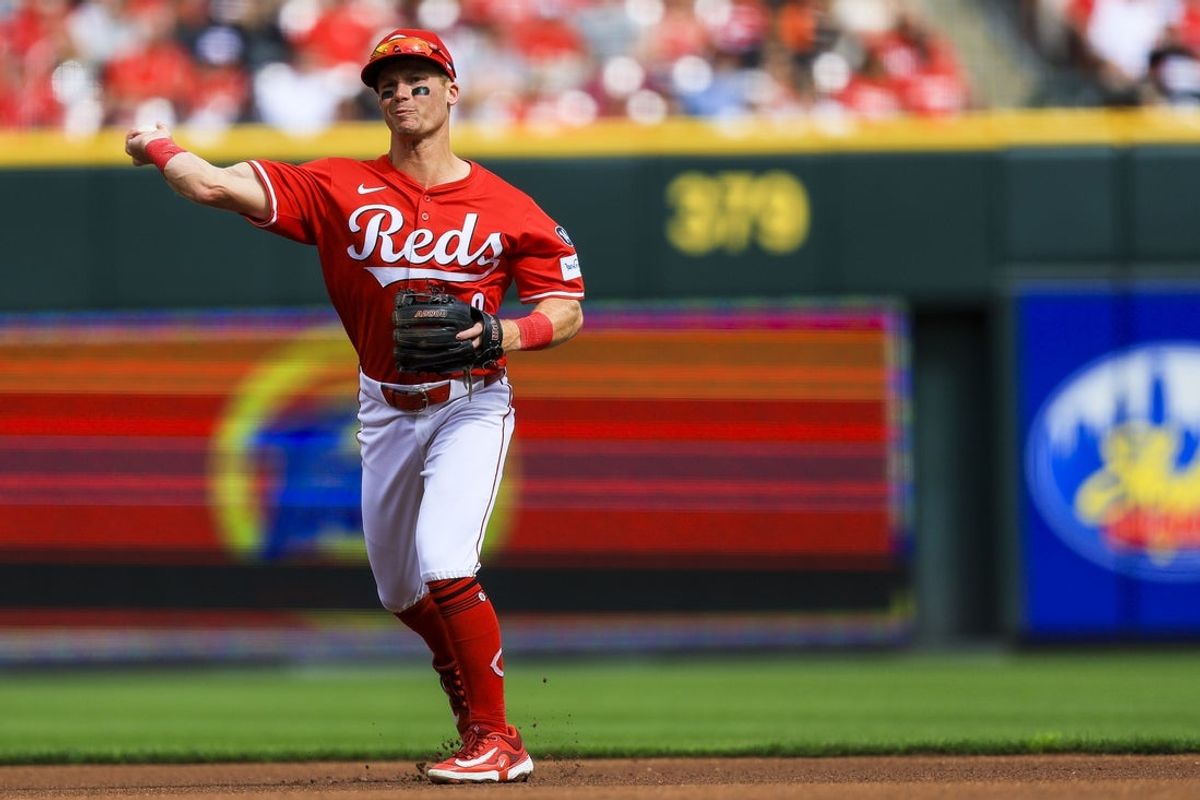 Mar 29, 2025; Cincinnati, Ohio, USA; Cincinnati Reds second baseman Matt McLain (9) throws to first to get San Francisco Giants outfielder Jung Hoo Lee (not pictured) out in the first inning at Great American Ball Park. Mandatory Credit: Katie Stratman-Imagn Images