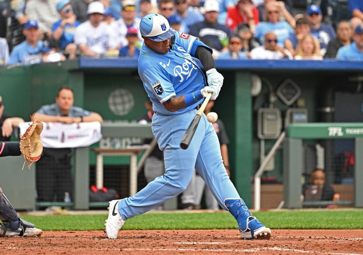 Mar 29, 2025; Kansas City, Missouri, USA; Kansas City Royals catcher Salvador Perez (13) hit an RBI single in the fourth inning against the Cleveland Guardians at Kauffman Stadium. Mandatory Credit: Peter Aiken-Imagn Images