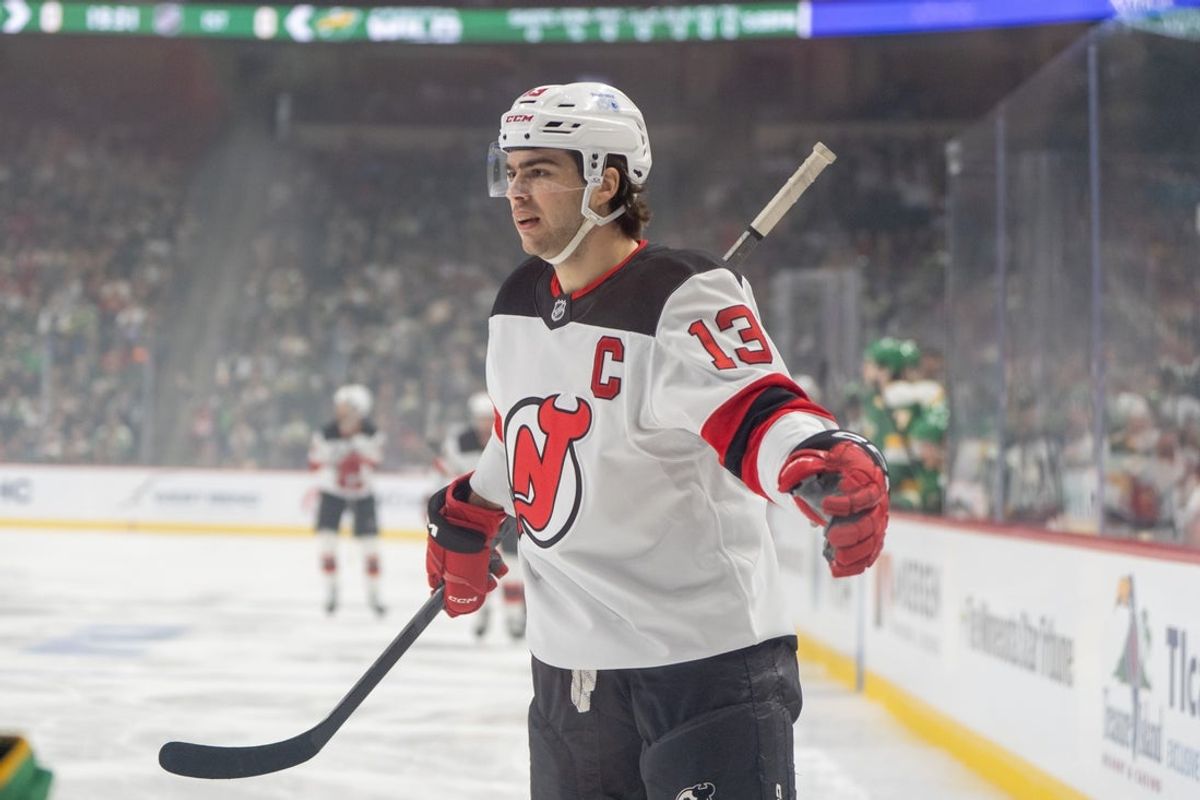 Mar 29, 2025; Saint Paul, Minnesota, USA; New Jersey Devils center Nico Hischier (13) scores the first goal of the game off a rebound from a shot from left wing Jesper Bratt (63) against Minnesota Wild goaltender Filip Gustavsson (32) in the first period at Xcel Energy Center. Mandatory Credit: Matt Blewett-Imagn Images