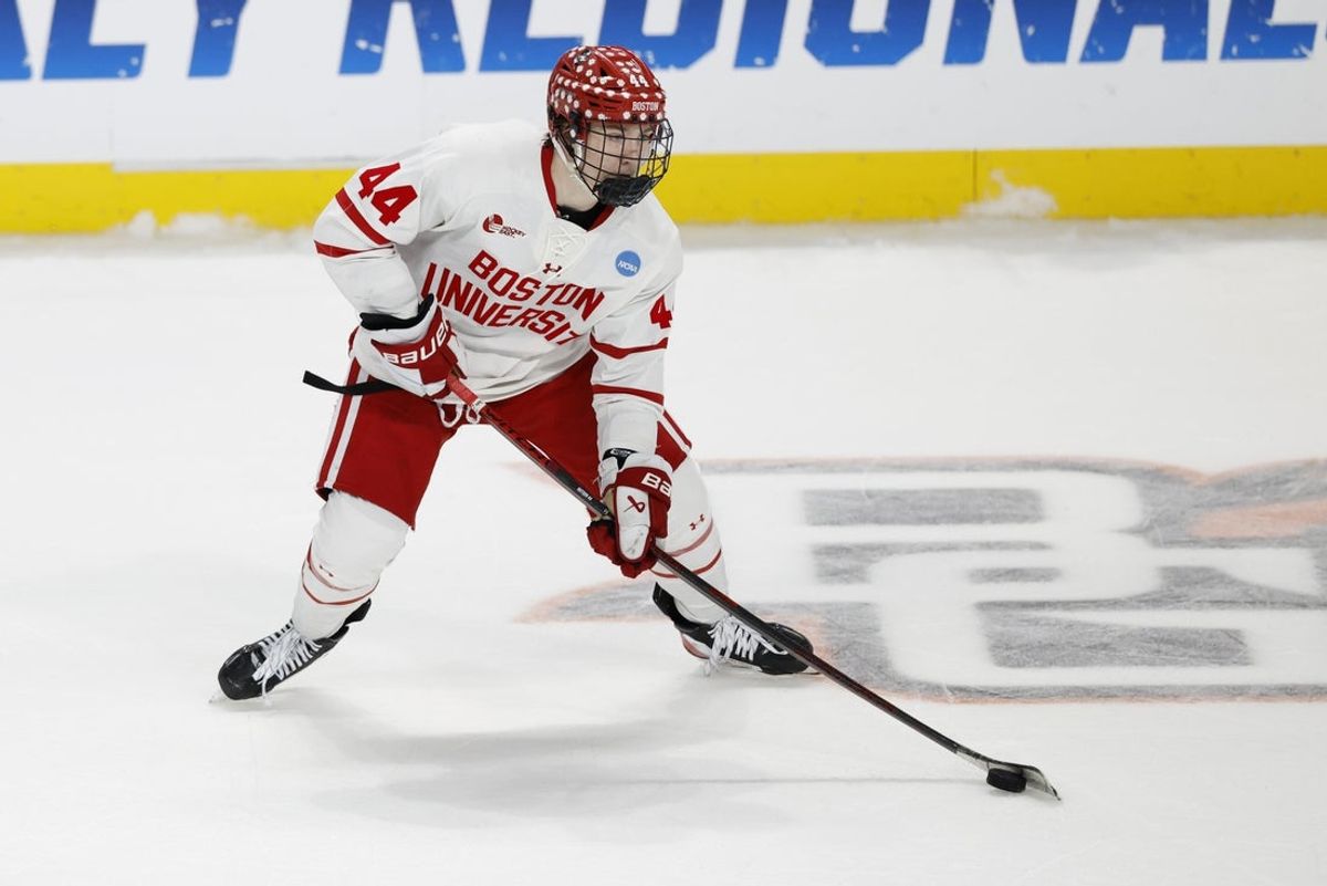 Mar 29, 2025; Toledo, OH, USA; Boston University defenseman Cole Hutson (44) skates with the puck in the third period against the Cornell at Huntington Center. Mandatory Credit: Rick Osentoski-Imagn Images
