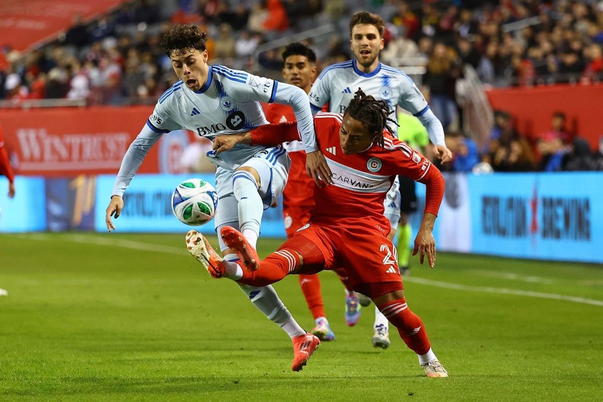 Mar 29, 2025; Chicago, Illinois, USA; CF Montreal midfielder Caden Clark (23) and Chicago Fire FC defender Leonardo Barroso (2) attempt to get a ball during the first half at Soldier Field. Mandatory Credit: Mike Dinovo-Imagn Images