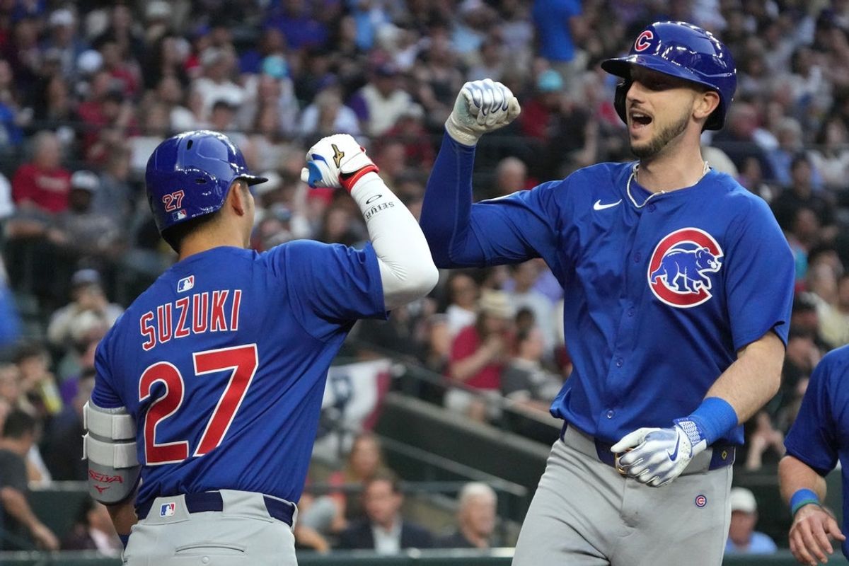 Mar 29, 2025; Phoenix, Arizona, USA; Chicago Cubs outfielder Kyle Tucker (30) celebrates with outfielder Seiya Suzuki (27) after hitting a two-run home run against the Arizona Diamondbacks in the fifth inning at Chase Field. Mandatory Credit: Rick Scuteri-Imagn Images