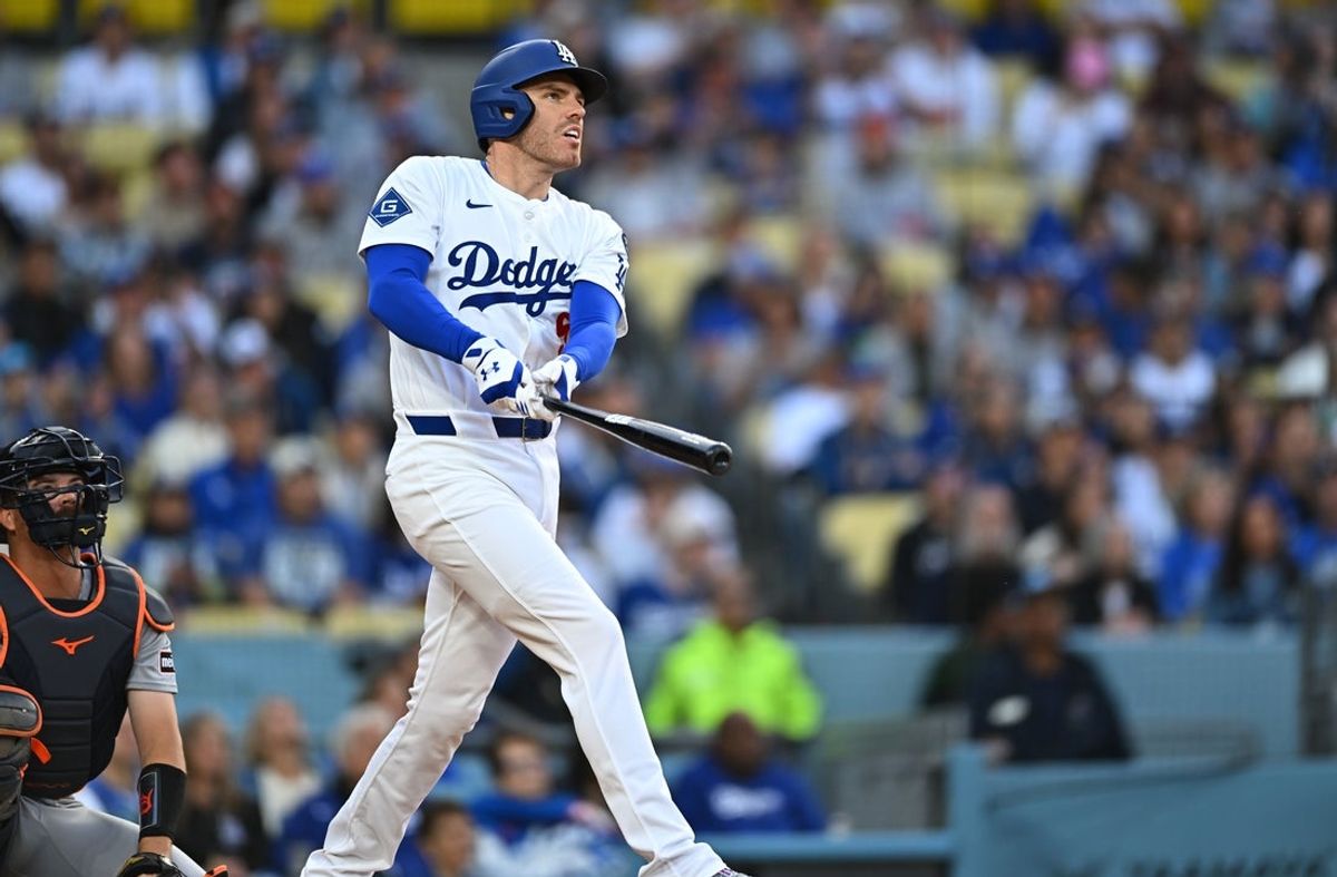 Mar 29, 2025; Los Angeles, California, USA; Los Angeles Dodgers first baseman Freddie Freeman (5) hits a home run during the 1st inning against the Detroit Tigers at Dodger Stadium. Mandatory Credit: Jonathan Hui-Imagn Images