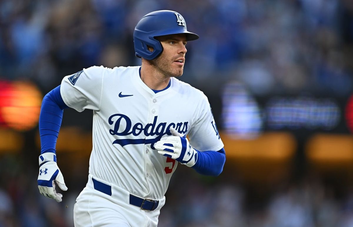 Mar 29, 2025; Los Angeles, California, USA; Los Angeles Dodgers first baseman Freddie Freeman (5) hits a home run during the 1st inning against the Detroit Tigers at Dodger Stadium. Mandatory Credit: Jonathan Hui-Imagn Images
