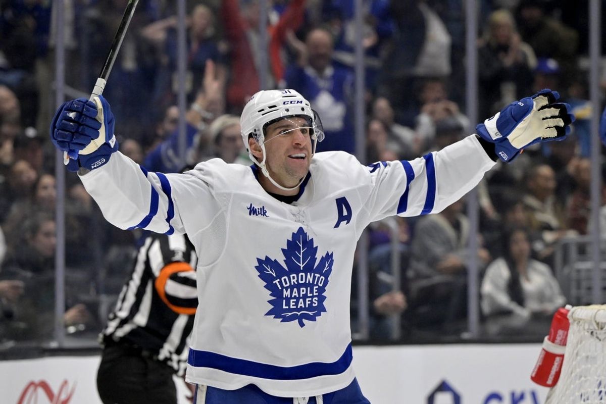 Mar 29, 2025; Los Angeles, California, USA;  Toronto Maple Leafs center John Tavares (91) celebrates after scoring in the third period against the Los Angeles Kings at Crypto.com Arena. Mandatory Credit: Jayne Kamin-Oncea-Imagn Images