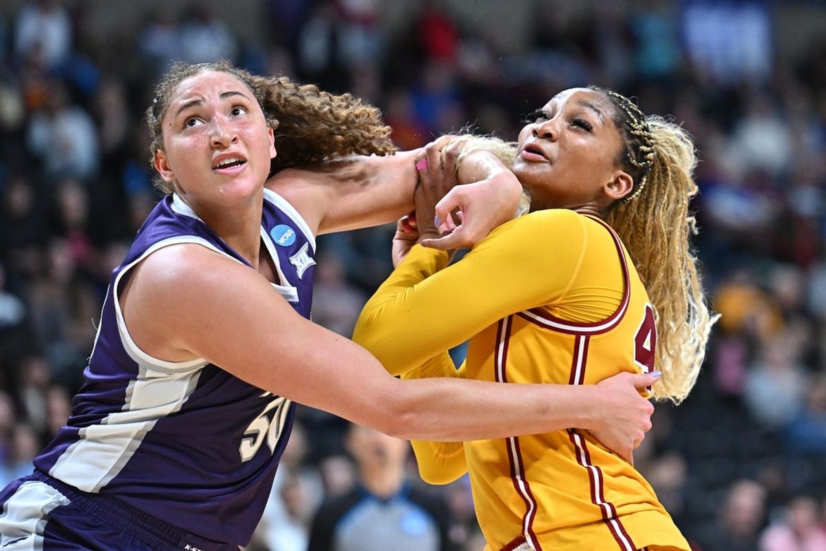 Mar 29, 2025; Spokane, WA, USA; Kansas State Wildcats center Ayoka Lee (50) fights for position against USC Trojans forward Kiki Iriafen (44) during the second half of a Sweet 16 NCAA Tournament basketball game against the Kansas State Wildcats at Spokane Arena. Mandatory Credit: James Snook-Imagn Images
