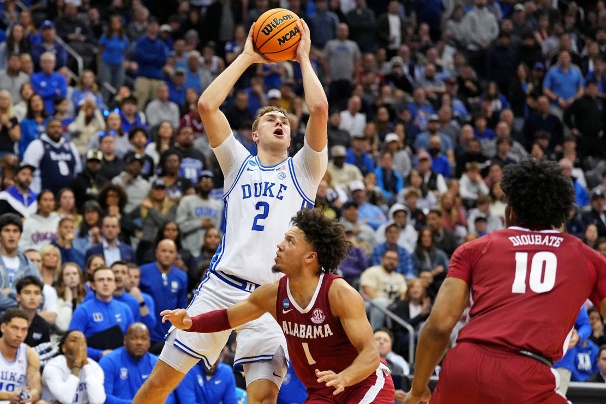 Mar 29, 2025; Newark, NJ, USA; Duke Blue Devils forward Cooper Flagg (2) shoots the ball against Alabama Crimson Tide guard Mark Sears (1) during the second half in the East Regional final of the 2025 NCAA tournament at Prudential Center. Mandatory Credit: Robert Deutsch-Imagn Images