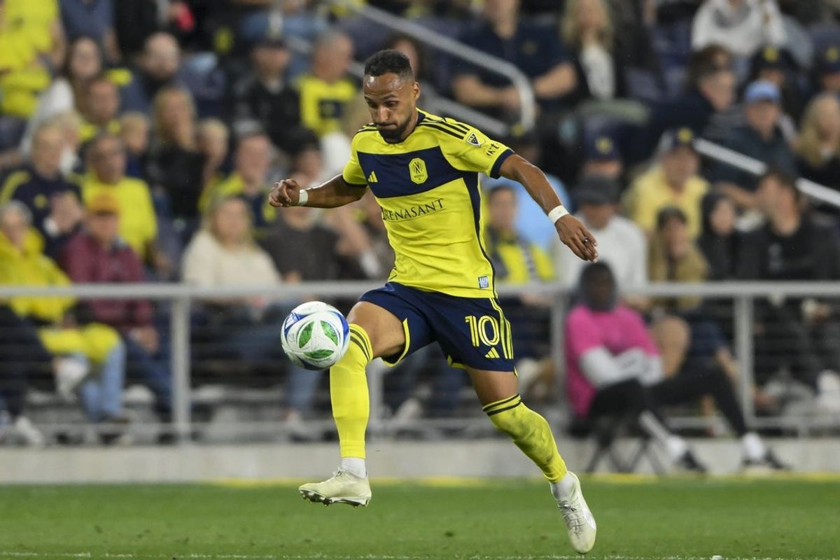 Mar 29, 2025; Nashville, Tennessee, USA;  Nashville SC midfielder Hany Mukhtar (10) dribbles the ball against the FC Cincinnati during the second half at Geodis Park. Mandatory Credit: Steve Roberts-Imagn Images