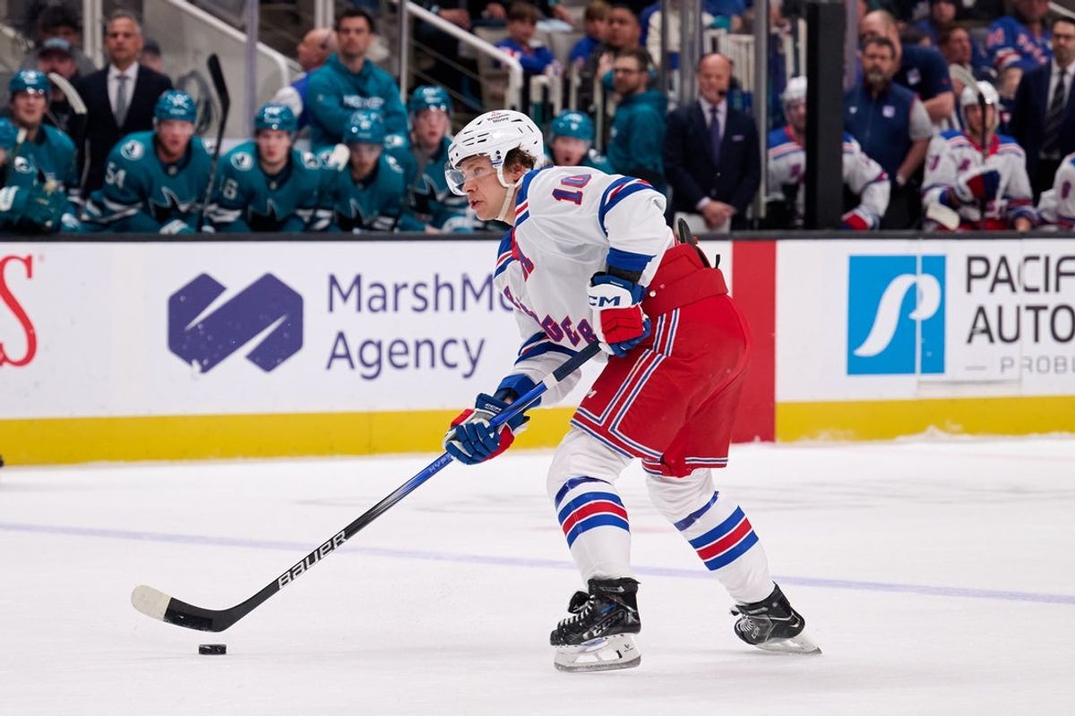 Mar 29, 2025; San Jose, California, USA; New York Rangers left wing Artemi Panarin (10) controls the puck against the San Jose Sharks during the first period at SAP Center at San Jose. Mandatory Credit: Robert Edwards-Imagn Images