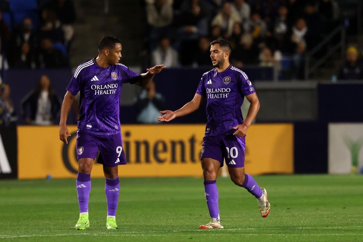 Mar 29, 2025; Carson, California, USA;  Orlando City midfielder Martin Ojeda (10) celebrates with forward Luis Muriel (9) after scoring a penalty kick goal during the second half against the LA Galaxy at Dignity Health Sports Park. Mandatory Credit: Kiyoshi Mio-Imagn Images