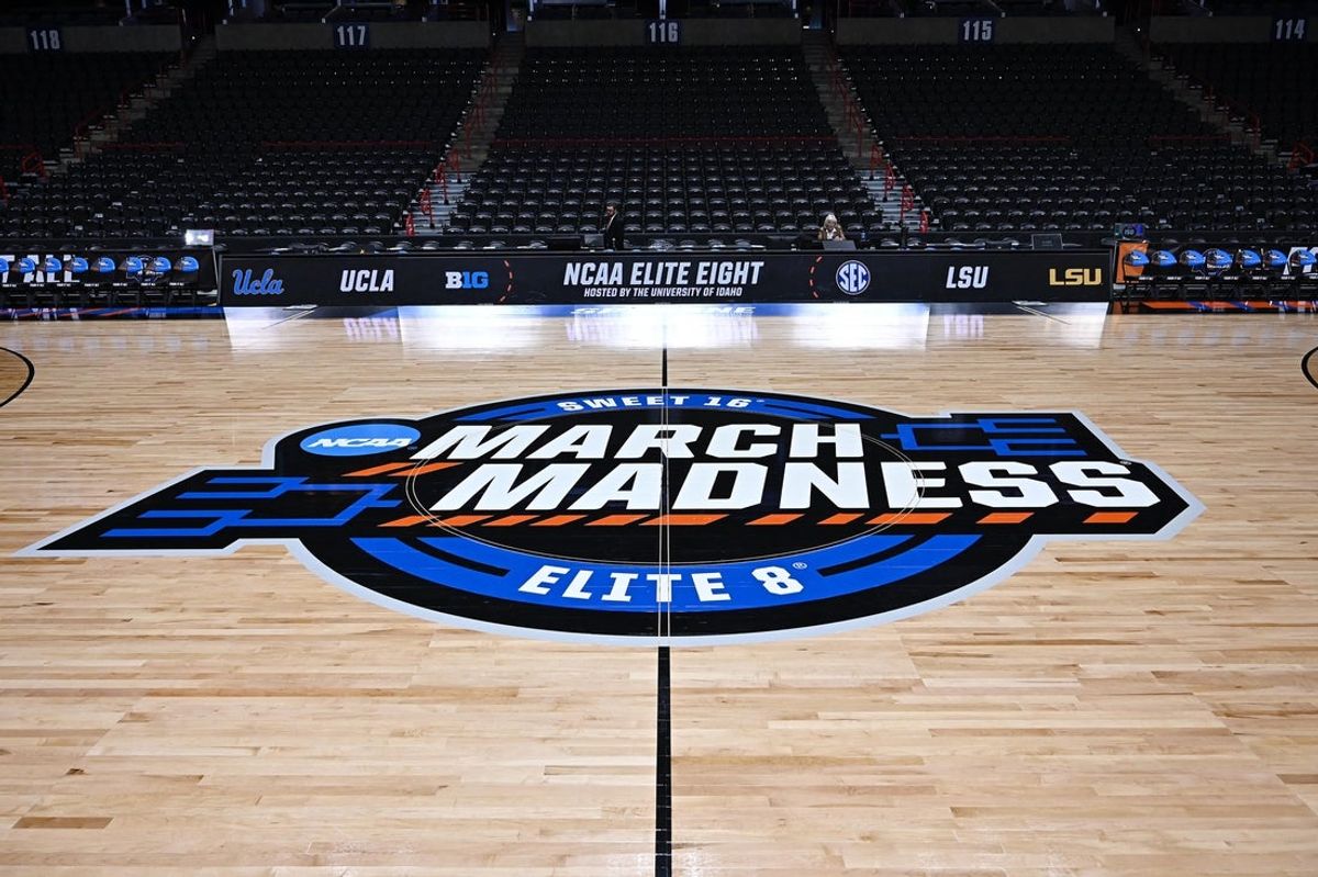 Mar 30, 2025; Spokane, WA, USA; NCAA logo at center court during the Elite 8 NCAA Tournament basketball game at Spokane Arena. Mandatory Credit: James Snook-Imagn Images