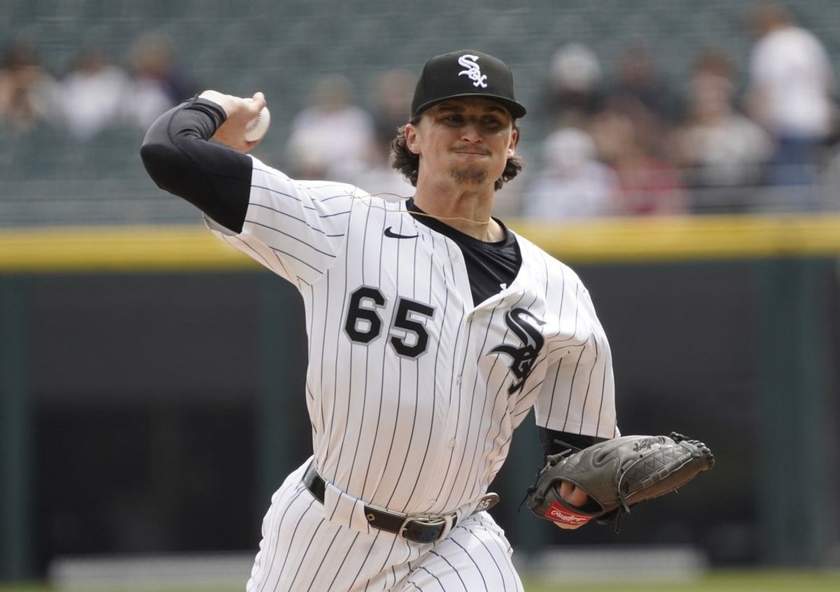 Mar 30, 2025; Chicago, Illinois, USA; Chicago White Sox pitcher Davis Martin (65) throws the ball against the Los Angeles Angels during the first inning at Guaranteed Rate Field. Mandatory Credit: David Banks-Imagn Images