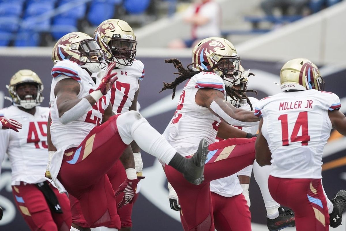 Panthers players celebrate after they intercepted a pass during the UFL game between the Memphis Showboats and Michigan Panthers at Simmons Bank Liberty Stadium in Memphis, Tenn., on Sunday, March 30, 2025.