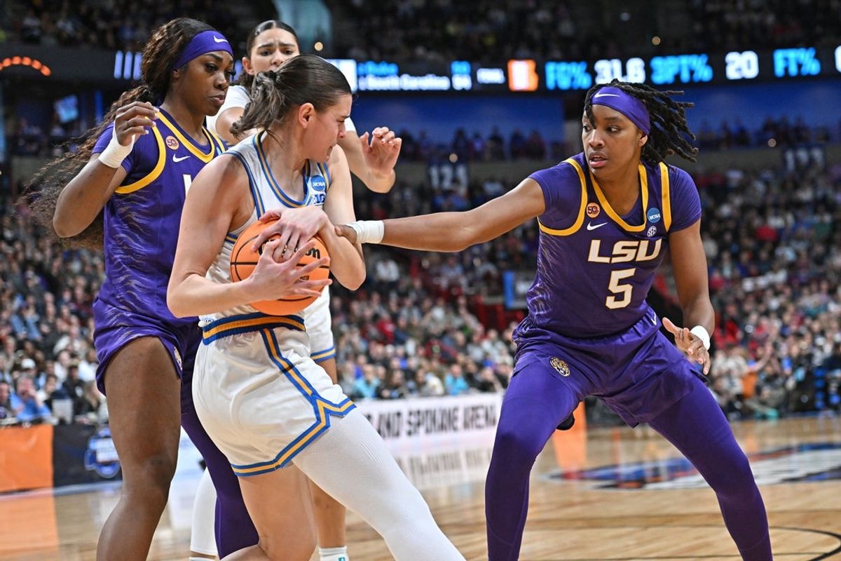 Mar 30, 2025; Spokane, WA, USA; LSU Lady Tigers forward Sa'Myah Smith (5) reaches in against UCLA Bruins guard Gabriela Jaquez (11) during the second half of a Elite 8 NCAA Tournament basketball game at Spokane Arena. Mandatory Credit: James Snook-Imagn Images