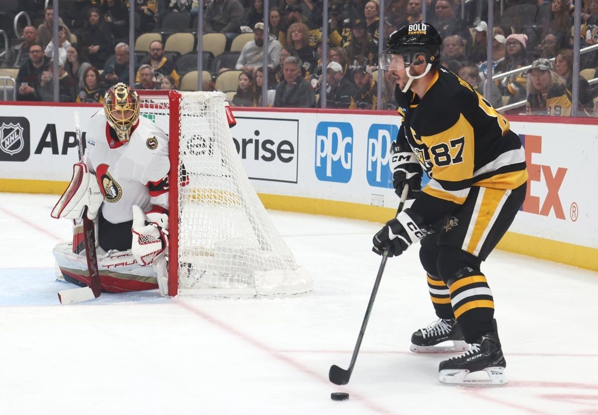 Mar 30, 2025; Pittsburgh, Pennsylvania, USA;  Ottawa Senators goaltender Anton Forsberg (31) guards the net as Pittsburgh Penguins center Sidney Crosby (87) handles the p[uck during the first period at PPG Paints Arena. Mandatory Credit: Charles LeClaire-Imagn Images