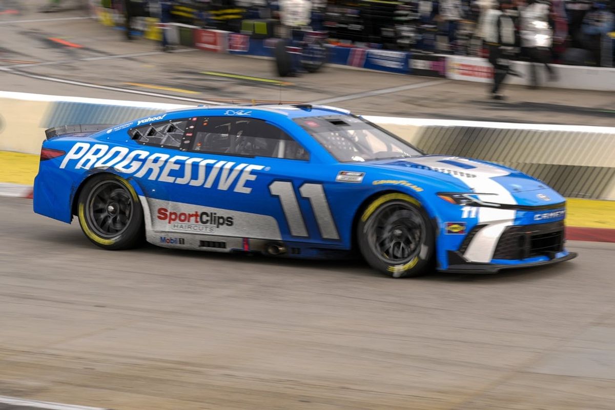 Mar 30, 2025; Martinsville, Virginia, USA; NASCAR Cup Series driver Denny Hamlin (11) out of turn four during the Cook Out 400 at Martinsville Speedway. Mandatory Credit: Jim Dedmon-Imagn Images