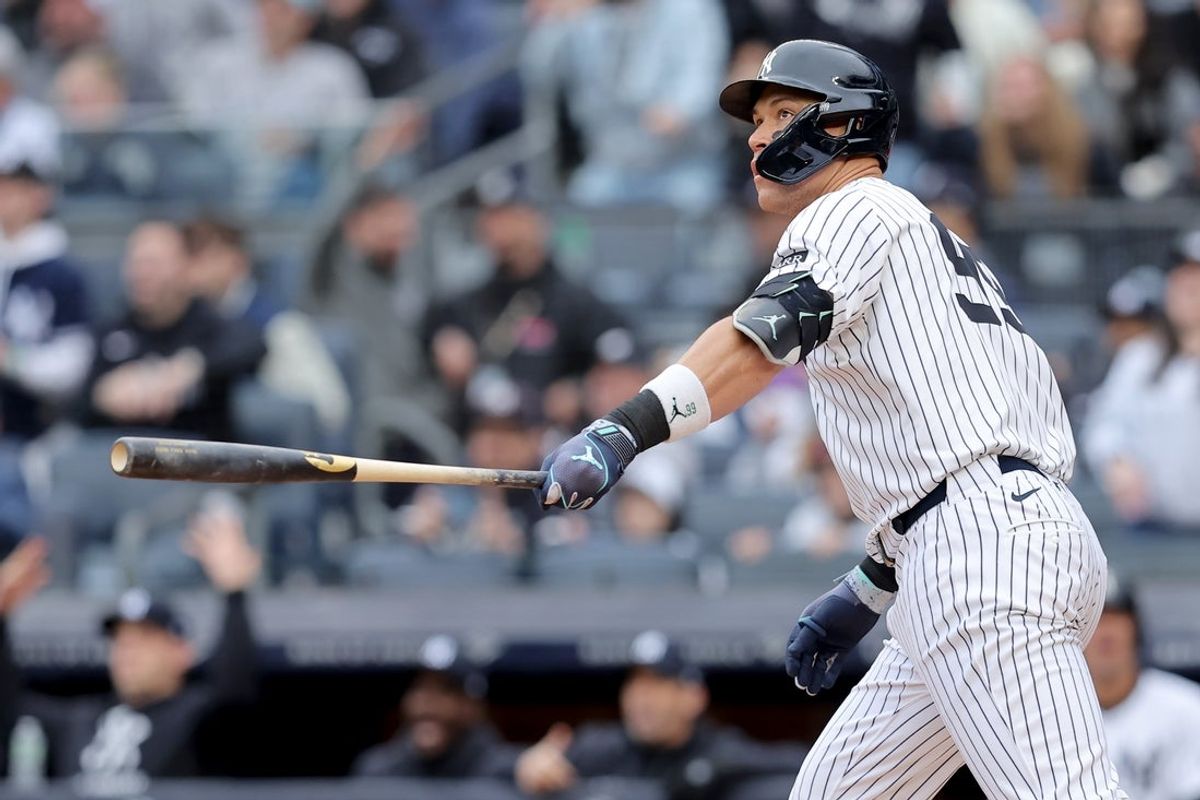 Mar 30, 2025; Bronx, New York, USA; New York Yankees right fielder Aaron Judge (99) watches his two run home run against the Milwaukee Brewers during the first inning at Yankee Stadium. Mandatory Credit: Brad Penner-Imagn Images