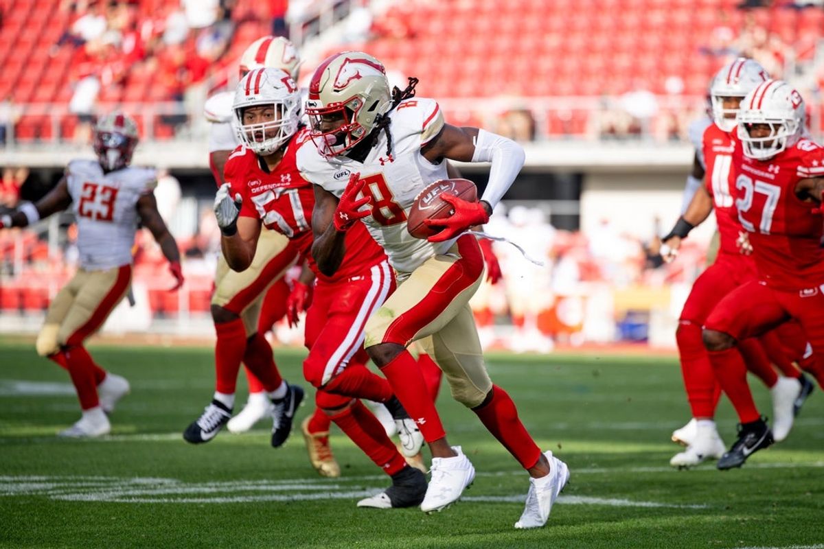 Mar 30, 2025; Washington, D.C., USA; Birmingham Stallions wide receiver Deon Cain (8) runs the ball as DC Defenders linebacker Anthony Hines III (57) defends in the second half at Audi Field. Mandatory Credit: Emily Faith Morgan-Imagn Images