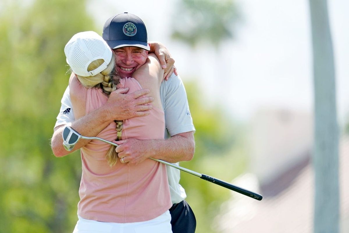 Steve Allan hugs his wife Bridget after winning The Galleri Classic at Mission Hills Country Club in Rancho Mirage, Calif., Sunday, March 30, 2025.