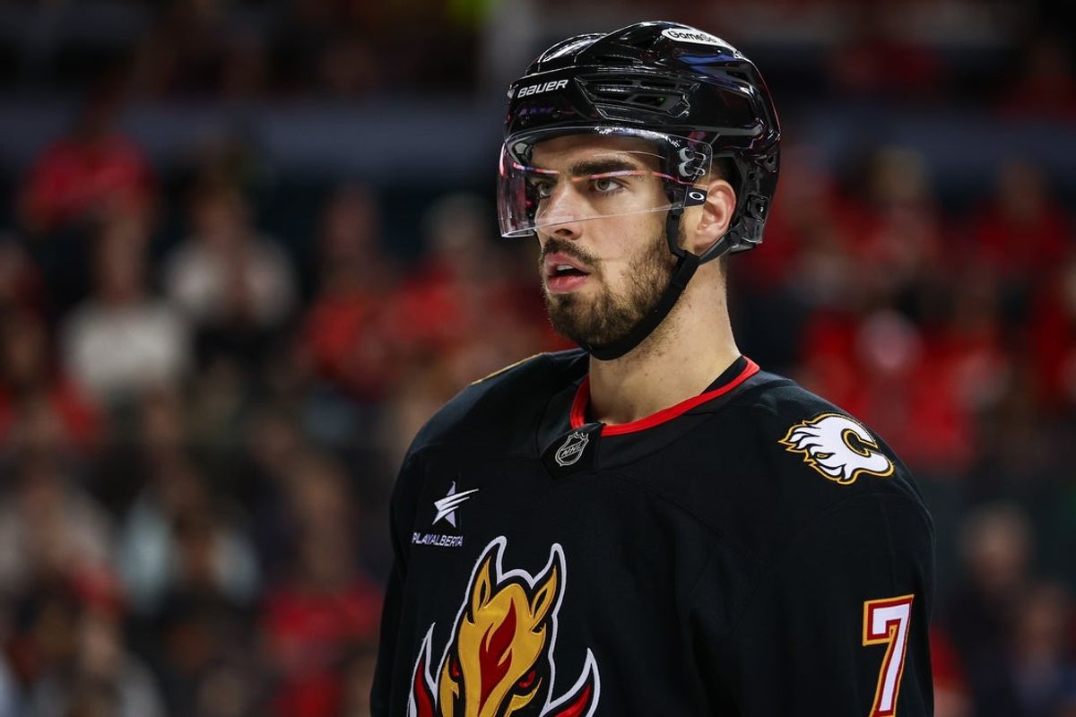 Mar 27, 2025; Calgary, Alberta, CAN; Calgary Flames defenseman Kevin Bahl (7) against the Dallas Stars during the third period at Scotiabank Saddledome. Mandatory Credit: Sergei Belski-Imagn Images
