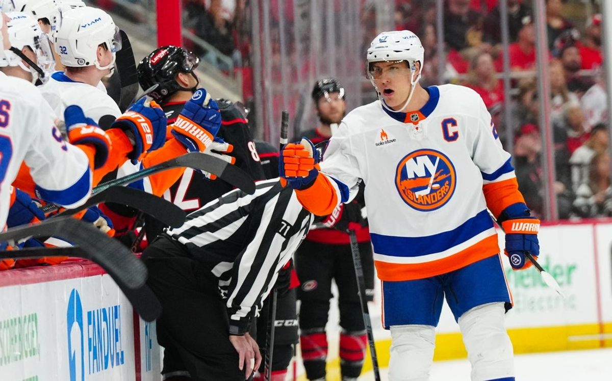 Mar 30, 2025; Raleigh, North Carolina, USA;  New York Islanders left wing Anders Lee (27) celebrates his goal against the Carolina Hurricanes during the third period at Lenovo Center. Mandatory Credit: James Guillory-Imagn Images