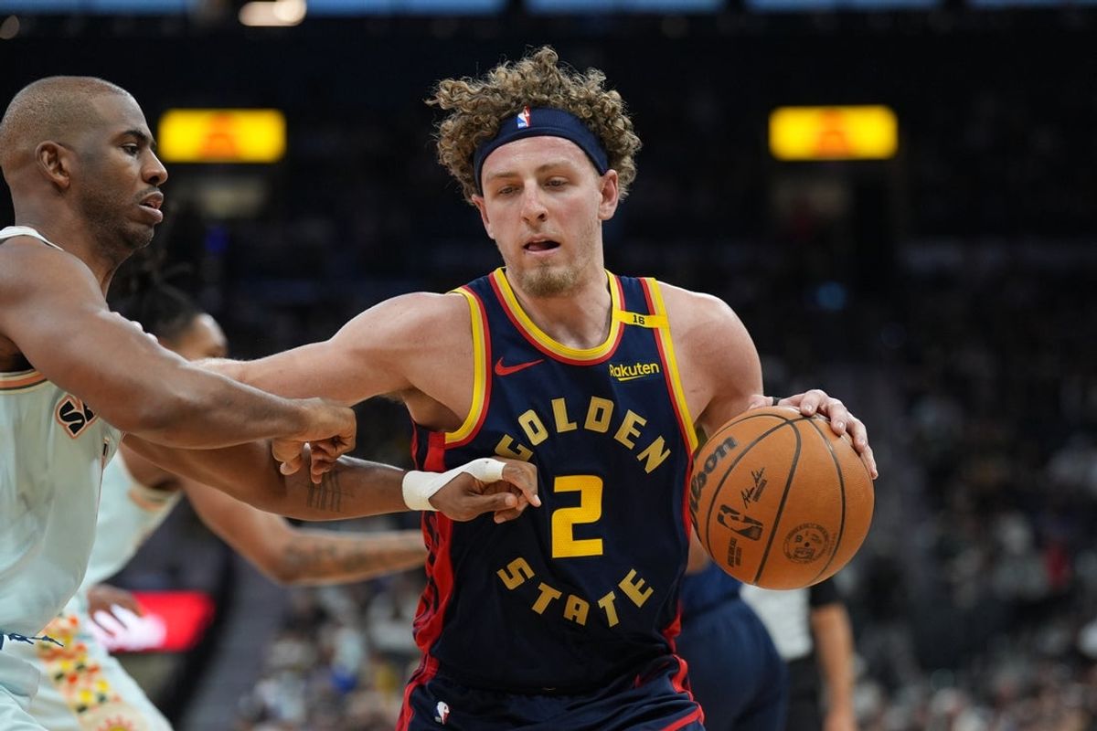 Mar 30, 2025; San Antonio, Texas, USA;  Golden State Warriors guard Brandin Podziemski (2) dribbles against San Antonio Spurs guard Chris Paul (3) in the first half at Frost Bank Center. Mandatory Credit: Daniel Dunn-Imagn Images