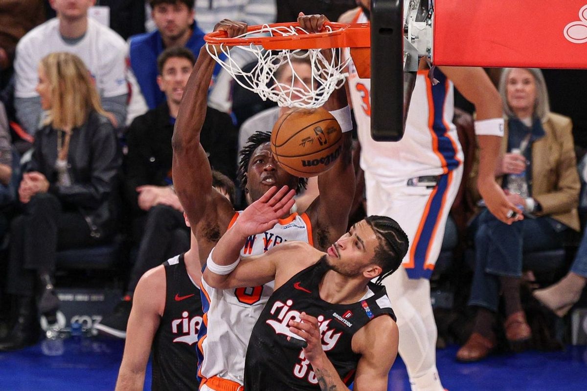 Mar 30, 2025; New York, New York, USA; New York Knicks forward OG Anunoby (8) dunks the ball against Portland Trail Blazers forward Toumani Camara (33) during the second half at Madison Square Garden. Mandatory Credit: Vincent Carchietta-Imagn Images