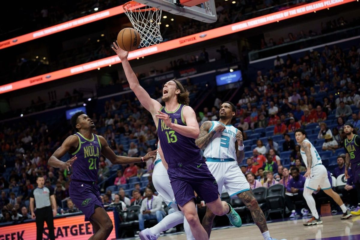 Mar 30, 2025; New Orleans, Louisiana, USA;  New Orleans Pelicans forward Kelly Olynyk (13) shoots against Charlotte Hornets center Jusuf Nurkic (11) and guard DaQuan Jeffries (3) during the first half at Smoothie King Center. Mandatory Credit: Matthew Hinton-Imagn Images