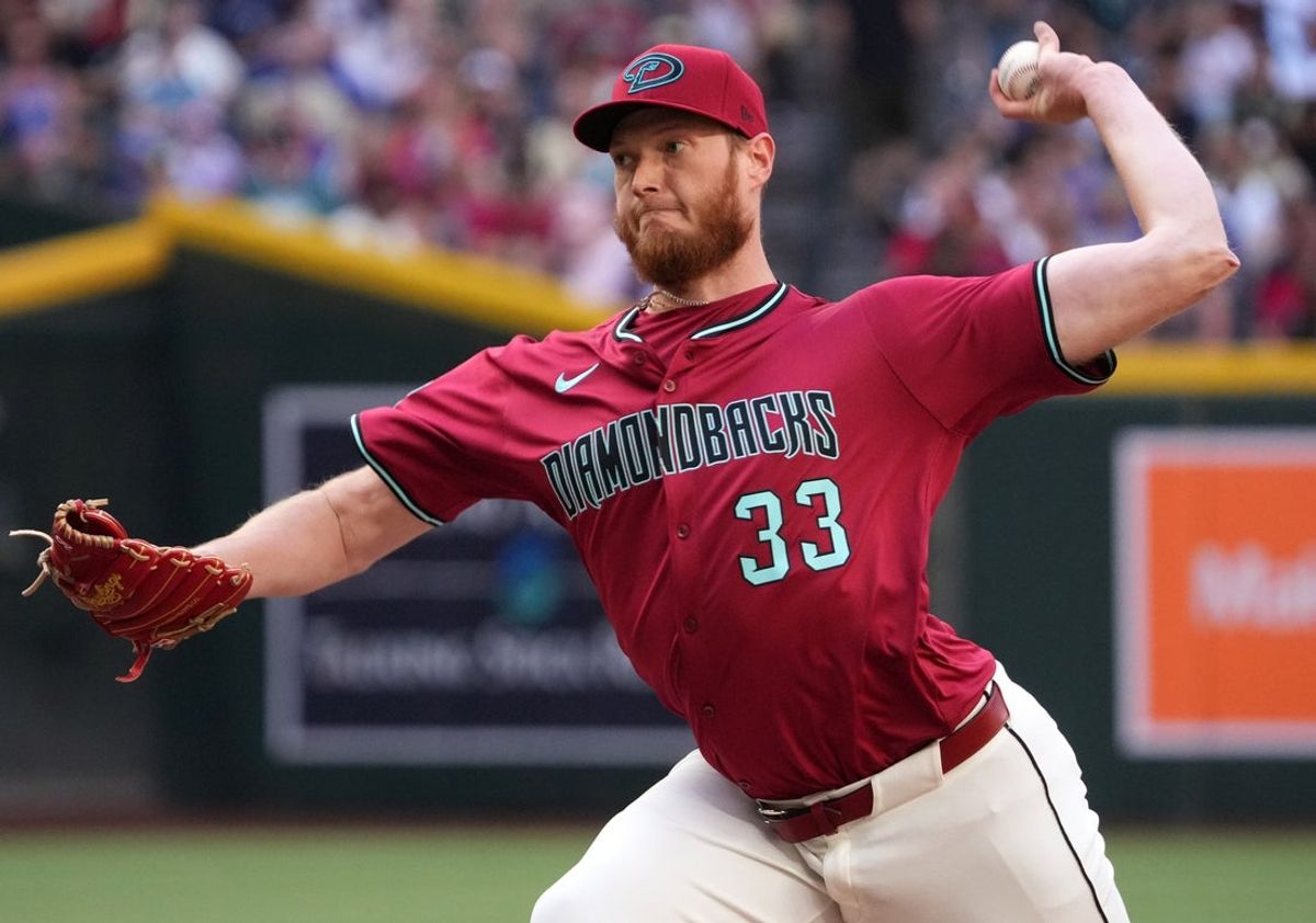 Arizona Diamondbacks left-hander A.J. Puk (33) pitches against the Chicago Cubs at Chase Field in Phoenix on Sunday, March 30, 2025.