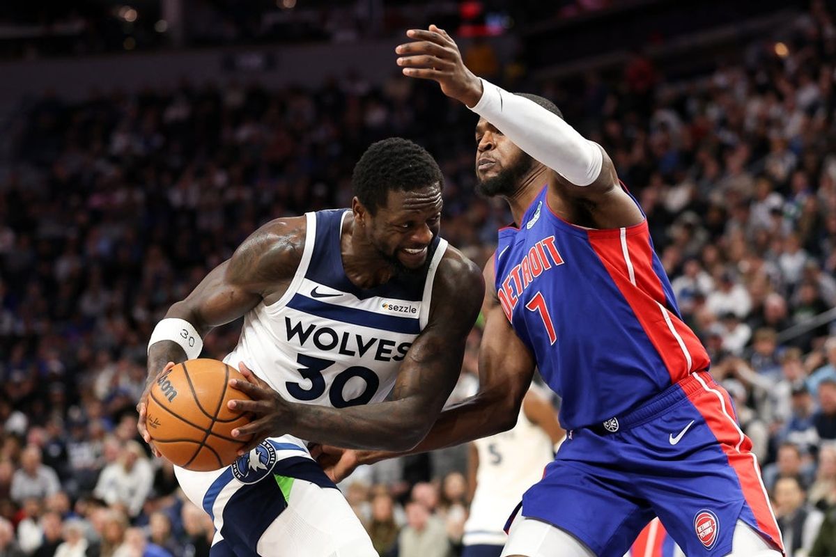 Mar 30, 2025; Minneapolis, Minnesota, USA; Minnesota Timberwolves forward Julius Randle (30) works towards the basket as Detroit Pistons forward Paul Reed (7) defends during the third quarter at Target Center. Mandatory Credit: Matt Krohn-Imagn Images
