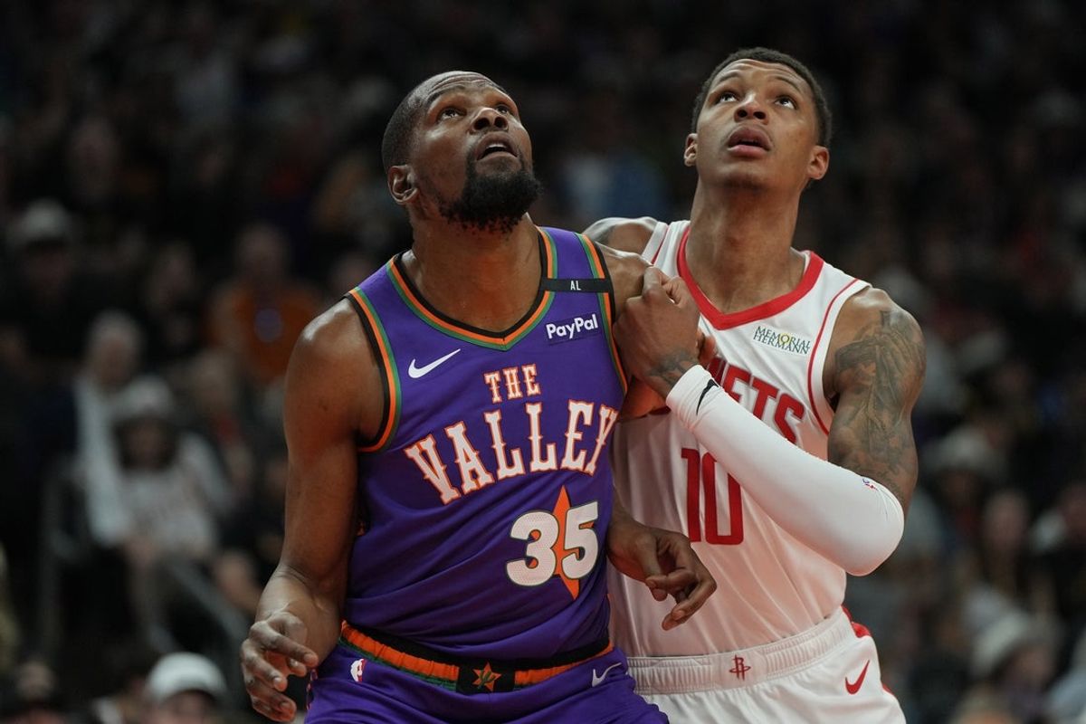 Mar 30, 2025; Phoenix, Arizona, USA; Phoenix Suns forward Kevin Durant (35) and Houston Rockets forward Jabari Smith Jr. (10) fight for position in the first half at Footprint Center. Mandatory Credit: Rick Scuteri-Imagn Images