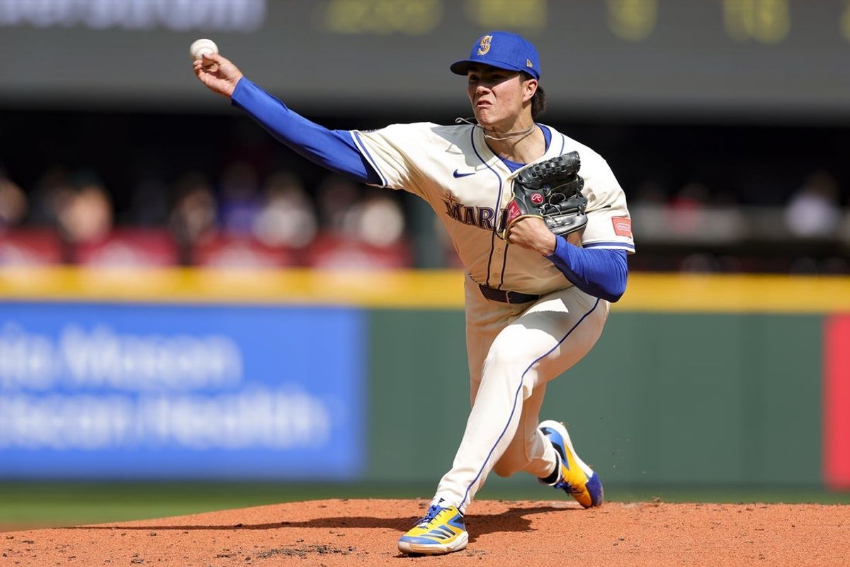 Mar 30, 2025; Seattle, Washington, USA; Seattle Mariners starting pitcher Bryan Woo throws during the second inning of a game against the Oakland Athletics at T-Mobile Park. Mandatory Credit: Ryan Sun-Imagn Images