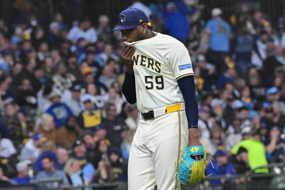 Mar 31, 2025; Milwaukee, Wisconsin, USA; Milwaukee Brewers pitcher Elvis Peguero (59) reacts after a pitching change in the seventh inning against the Kansas City Royals at American Family Field. Mandatory Credit: Benny Sieu-Imagn Images