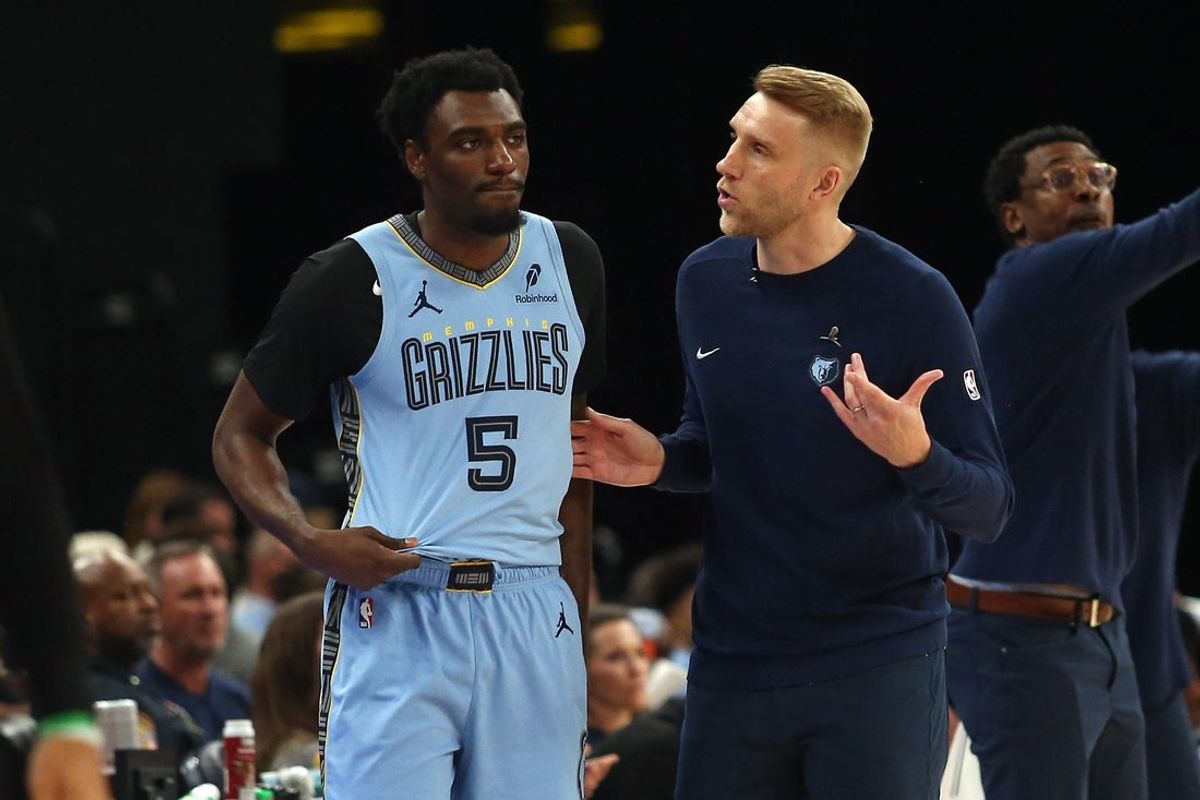 Mar 31, 2025; Memphis, Tennessee, USA; Memphis Grizzlies interim head coach Tuomas Iisalo (right) talks with Memphis Grizzlies guard Vince Williams Jr. (5) during the first quarter at FedExForum. Mandatory Credit: Petre Thomas-Imagn Images