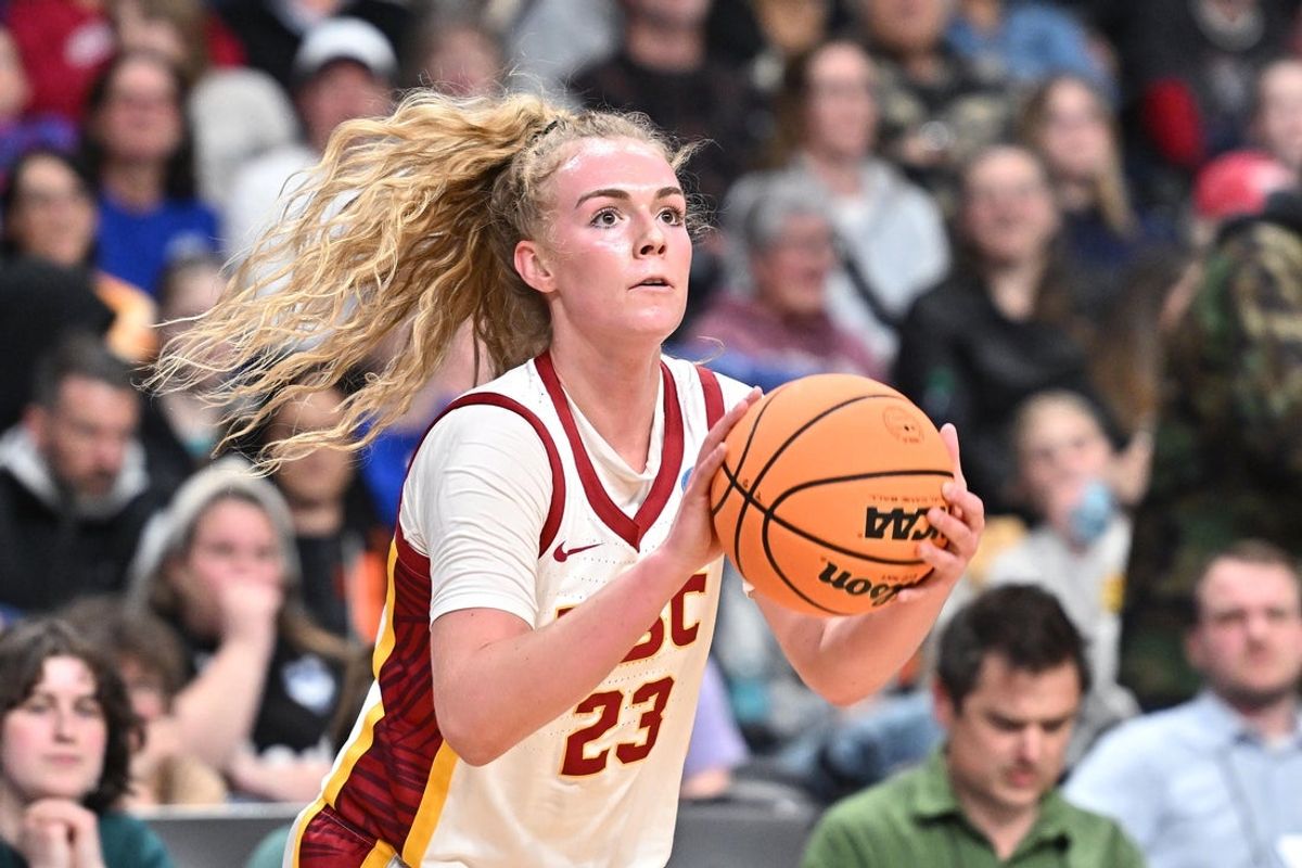Mar 31, 2025; Spokane, WA, USA; USC Trojans guard Avery Howell (23) shoots against the UConn Huskies during the first half of a Elite 8 NCAA Tournament basketball game at Spokane Arena. Mandatory Credit: James Snook-Imagn Images