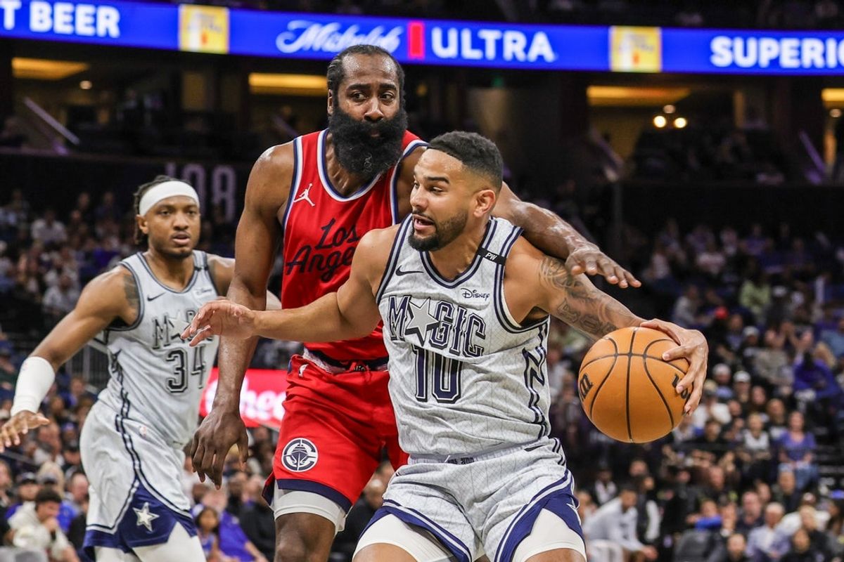Mar 31, 2025; Orlando, Florida, USA; LA Clippers guard James Harden (1) defends Orlando Magic guard Cory Joseph (10) during the second quarter at Kia Center. Mandatory Credit: Mike Watters-Imagn Images