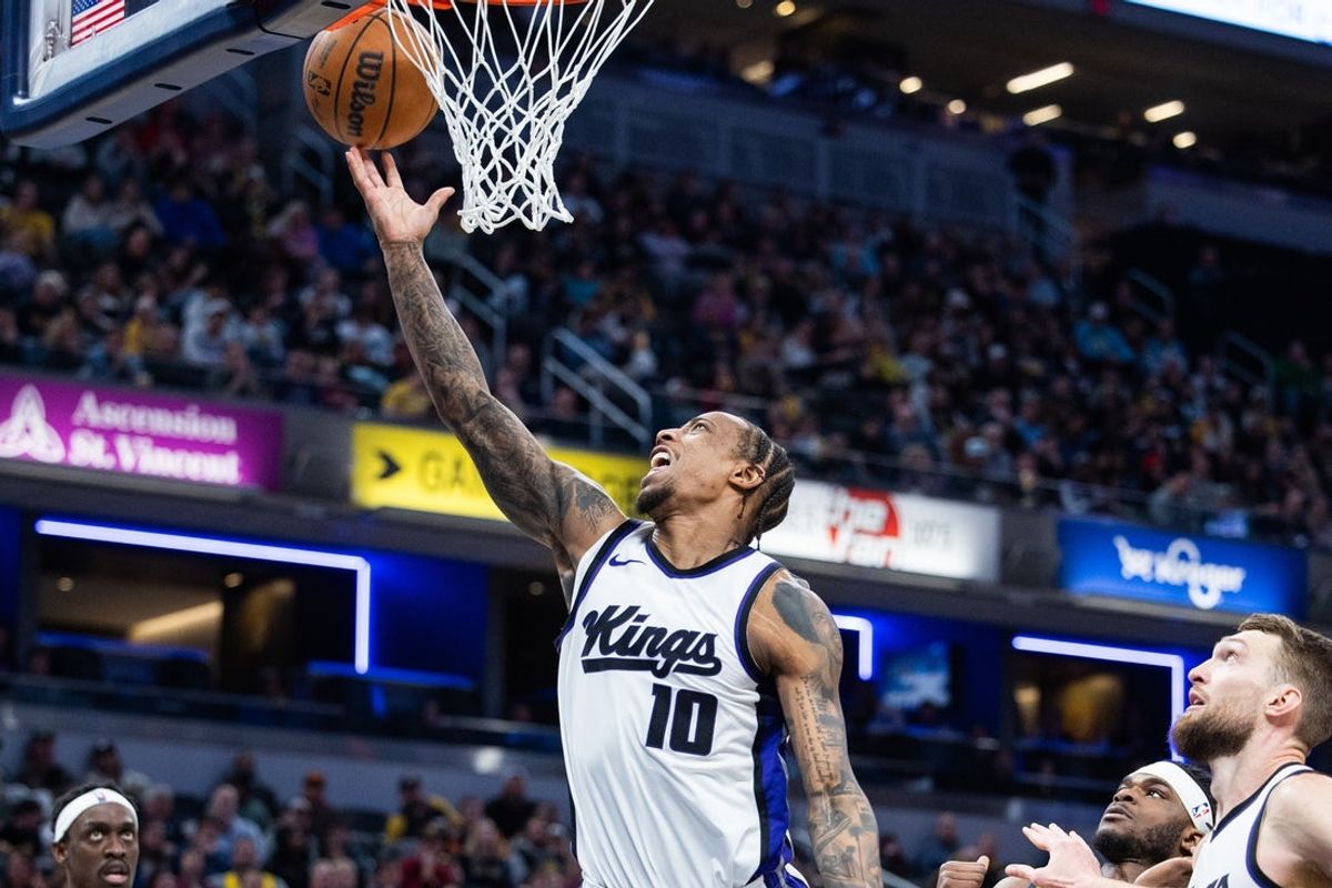 Mar 31, 2025; Indianapolis, Indiana, USA; Sacramento Kings forward DeMar DeRozan (10) shoots the ball whileIndiana Pacers forward Jarace Walker (5)  defends in the second half at Gainbridge Fieldhouse. Mandatory Credit: Trevor Ruszkowski-Imagn Images