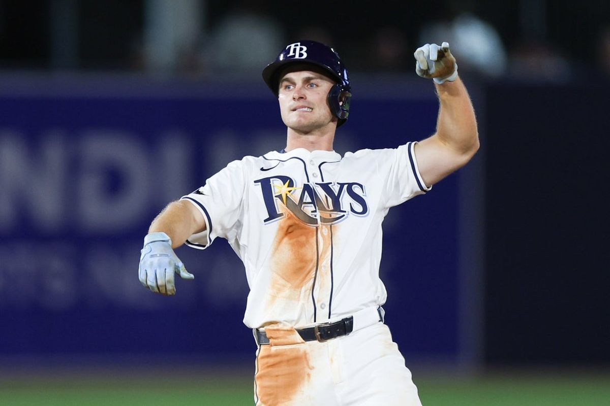 Mar 31, 2025; St. Petersburg, Florida, USA; Tampa Bay Rays right fielder Jake Mangum (28) celebrates after hitting a double against the Pittsburgh Pirates in the sixth inning  at George M. Steinbrenner Field. Mandatory Credit: Nathan Ray Seebeck-Imagn Images