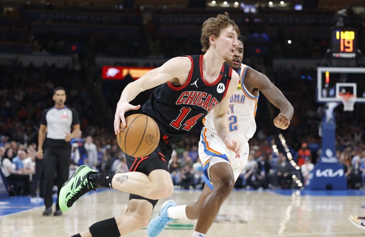 Mar 31, 2025; Oklahoma City, Oklahoma, USA; Chicago Bulls forward Matas Buzelis (14) drives around Oklahoma City Thunder guard Shai Gilgeous-Alexander (2) during the second half at Paycom Center. Mandatory Credit: Alonzo Adams-Imagn Images