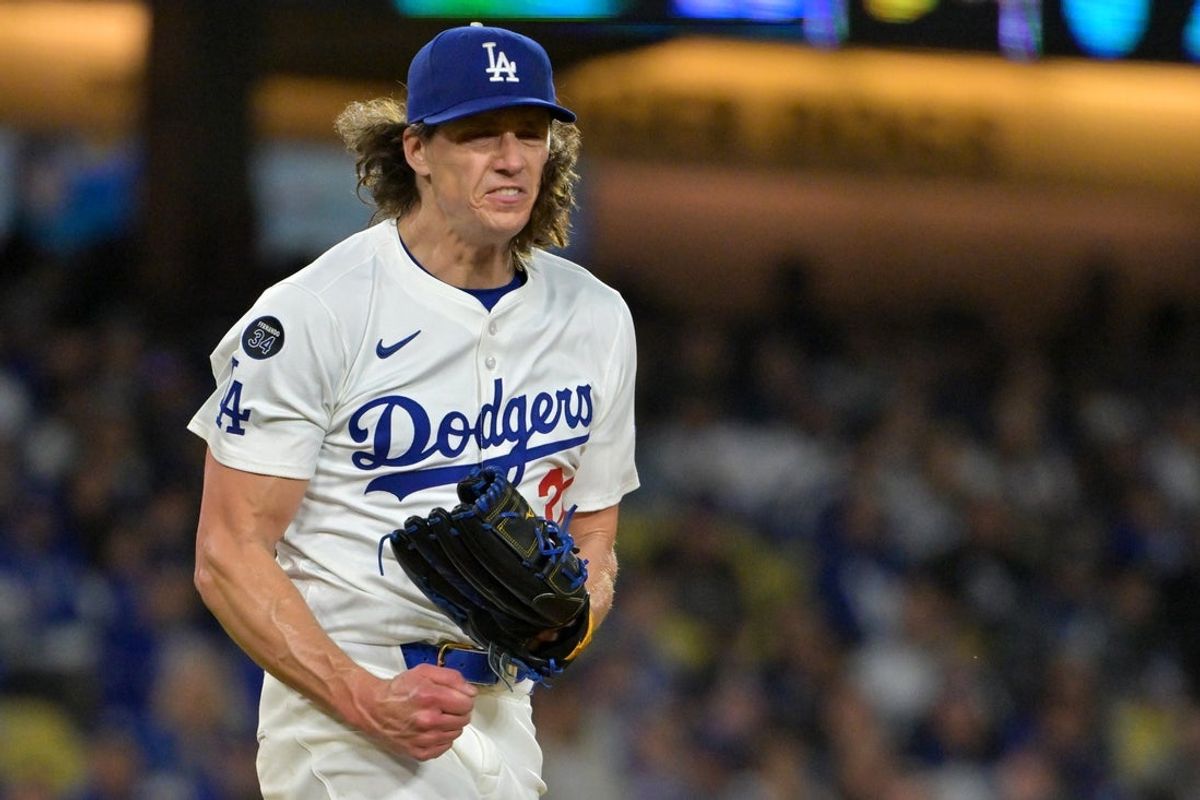 Mar 31, 2025; Los Angeles, California, USA;  Los Angeles Dodgers starting pitcher Tyler Glasnow (31) reacts after a strike out for the third out of the fifth inning against the Atlanta Braves at Dodger Stadium. Mandatory Credit: Jayne Kamin-Oncea-Imagn Images