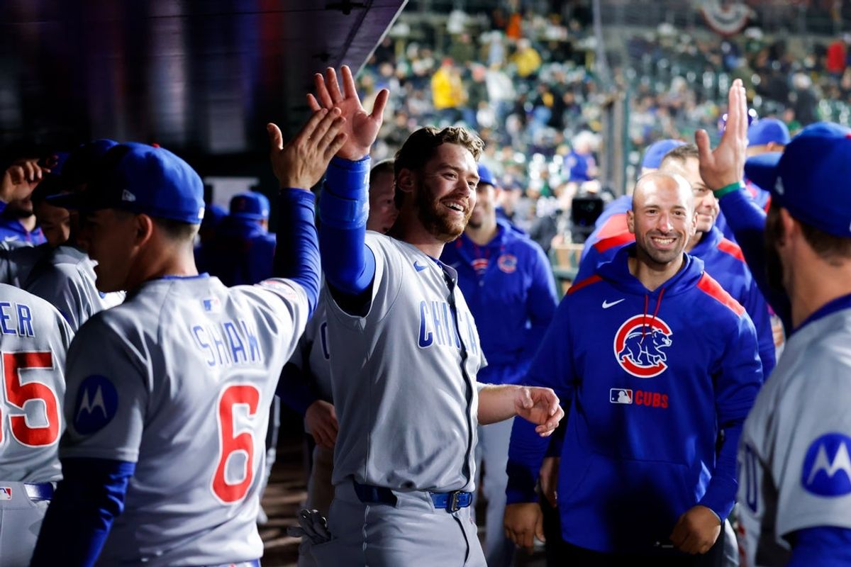 Mar 31, 2025; West Sacramento, California, USA; Chicago Cubs catcher Carson Kelly (15) is congratulated by teammates after hitting for the cycle during the eighth inning against the Athletics at Sutter Health Park. Mandatory Credit: Sergio Estrada-Imagn Images