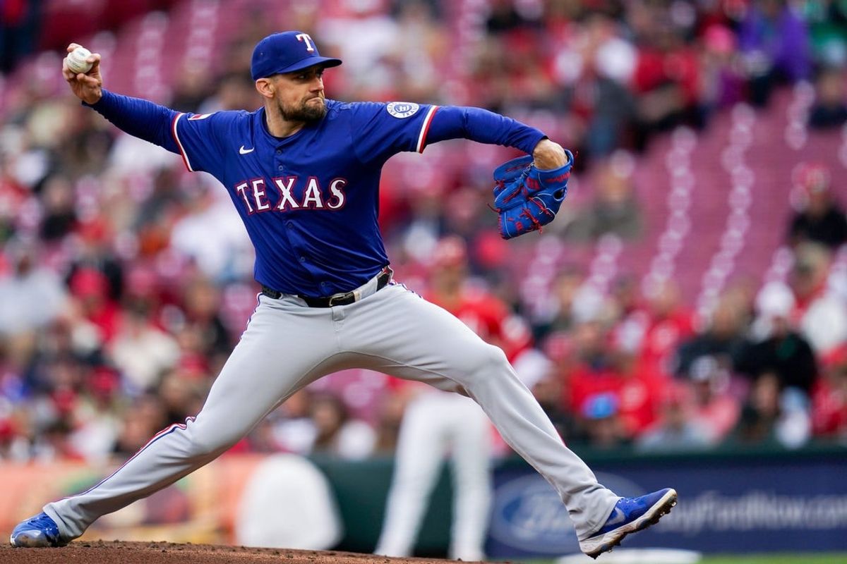 Texas Rangers pitcher Nathan Eovaldi (17) throws a pitch in the first inning of a MLB game between the Cincinnati Reds and Texas Rangers, Tuesday, April 1, 2025, at Great American Ball Park in Downtown Cincinnati.