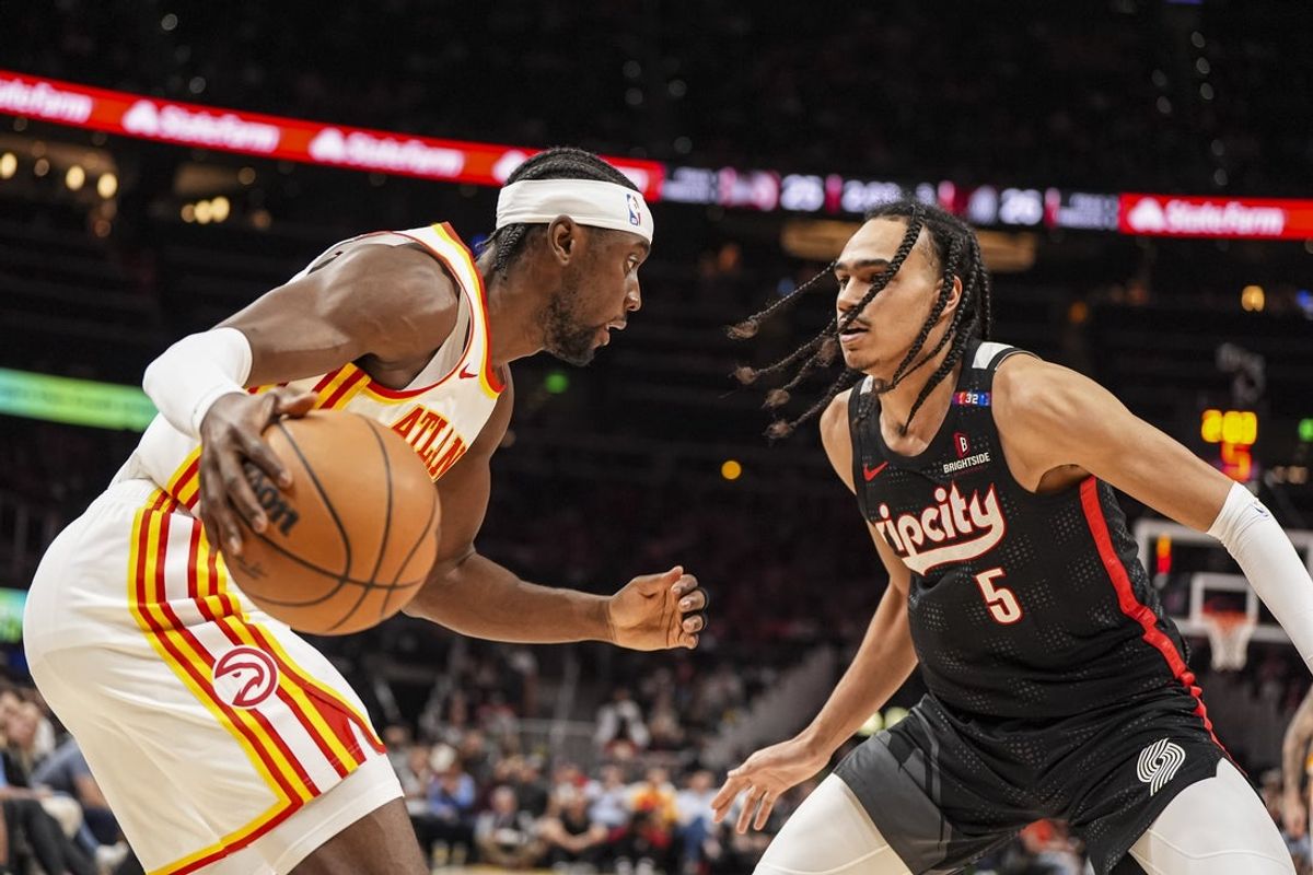 Apr 1, 2025; Atlanta, Georgia, USA; Atlanta Hawks guard Caris LeVert (3) dribbles against Portland Trail Blazers guard Dalano Banton (5) during the first half at State Farm Arena. Mandatory Credit: Dale Zanine-Imagn Images